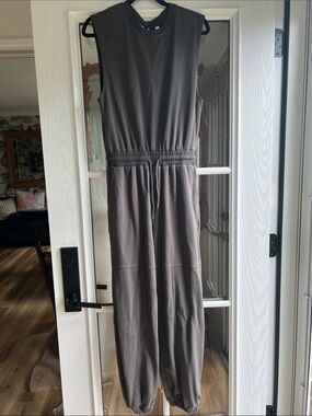 Army Green Khaki Jumpsuit with open back and elastic Hem size M